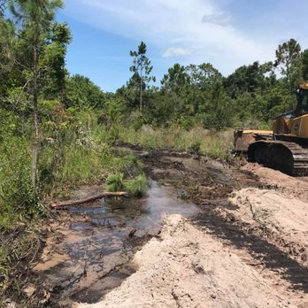 BaRaR Contracting - a bulldozer on a muddy road - Landscaping Near Me - Lake Placid, Florida BaRaR Contracting - a bulldozer on a muddy road - Landscaping Near Me - Lake Placid, Florida
