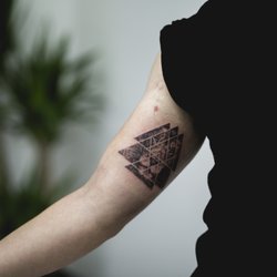 Playhouse Tattoo Studio - Triangular Geometric Lion Tattoo