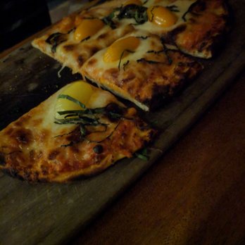 Tommy Bahama - Mozzarella flat bread pizza. Perfect amount of cheese, it was delicious. The yellow pieces that looks like an egg is actually sweet tomato. - Seafood Near Me - Kihei, Hawaii Tommy Bahama - Mozzarella flat bread pizza. Perfect amount of cheese, it was delicious. The yellow pieces that looks like an egg is actually sweet tomato. - Seafood Near Me - Kihei, Hawaii