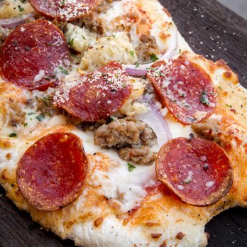 Scaddabush - The Butcher. Bacon, Berkshire sausage, pepperoni, mozzarella, roasted garlic, red onions, San Marzano tomato sauce. - Italian Near Me - Scarborough, Ontario Scaddabush - The Butcher. Bacon, Berkshire sausage, pepperoni, mozzarella, roasted garlic, red onions, San Marzano tomato sauce. - Italian Near Me - Scarborough, Ontario