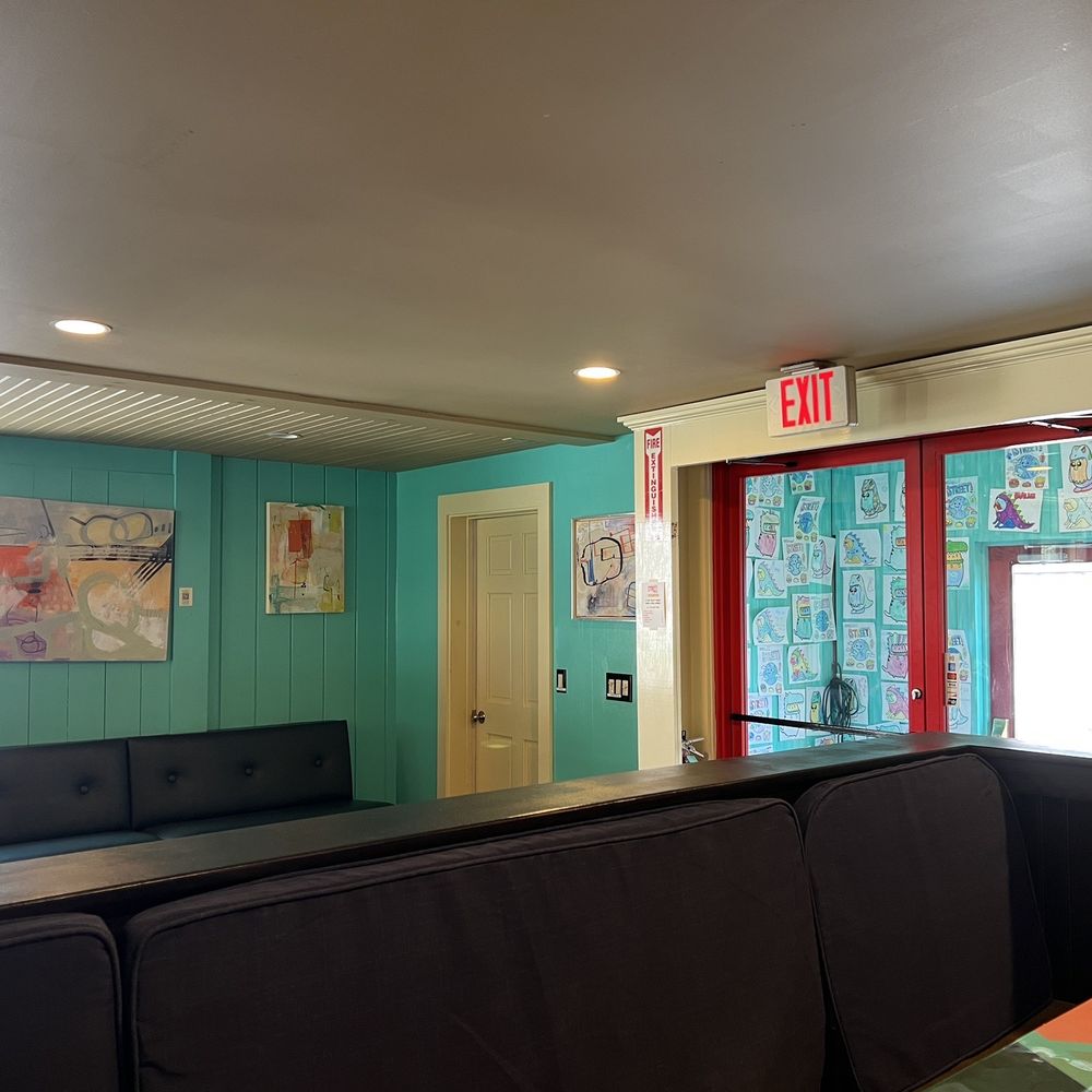 Street - Entryway view. Kids colorings on the wall and funky colored tabletops on the right. - New American Near Me - Exeter, New Hampshire Street - Entryway view. Kids colorings on the wall and funky colored tabletops on the right. - New American Near Me - Exeter, New Hampshire
