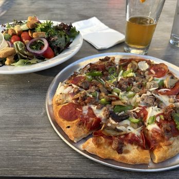 Uccello's - Downtown - Deluxe Pizza and side salad - delicious! - Sports Bars Near Me - Grand Rapids, Michigan