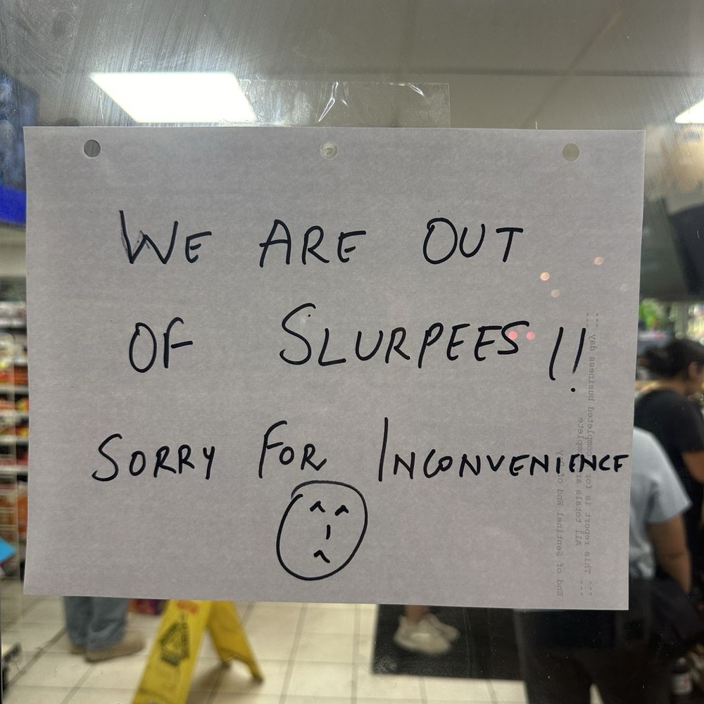 The sign on the door says "out of slurpeez" The sign on the door says "out of slurpeez"