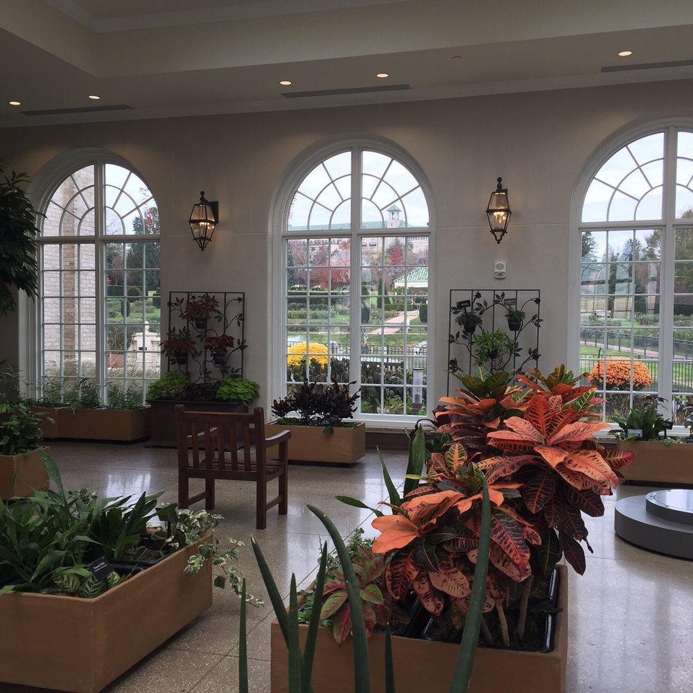 Hershey Gardens - A view from inside the conservatory looking towards Hersheypark. - Botanical Gardens Near Me - Hershey, Pennsylvania Hershey Gardens - A view from inside the conservatory looking towards Hersheypark. - Botanical Gardens Near Me - Hershey, Pennsylvania