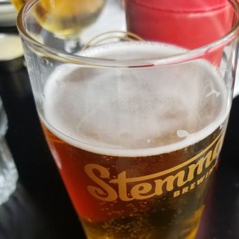 The Filling Station - a glass of beer and a plate of food - American Near Me - Bellingham, Washington