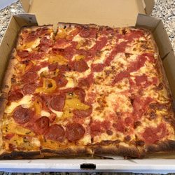 Pasticcio Fresh Italian Kitchen - Grandma Pie - half plain. Half pepperoni & roasted pepper. It's a thinner Sicilian that's cooked crisp.