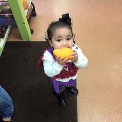 Uptown Fruit Market - This little Angle eating Mango