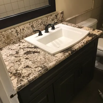 Murillo Construction - a sink and toilet in a bathroom - Electricians Near Me Murillo Construction - a sink and toilet in a bathroom - Electricians Near Me