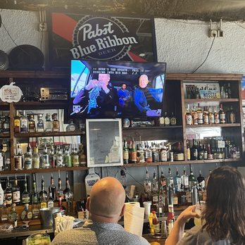 The Fillin Station - people sitting at a bar - Seafood Near Me - Biloxi, Mississippi