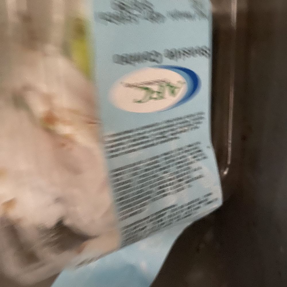 a bag of frozen chicken in a refrigerator a bag of frozen chicken in a refrigerator