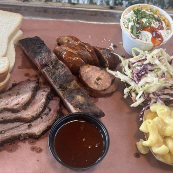 The Pit Room - Museum District - 3 meat plate - brisket, pork rib and jalapeño sausage. Sides - corn, coleslaw and Mac & cheese - Barbeque Near Me - Houston, Texas The Pit Room - Museum District - 3 meat plate - brisket, pork rib and jalapeño sausage. Sides - corn, coleslaw and Mac & cheese - Barbeque Near Me - Houston, Texas