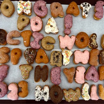 Delicious Donuts - a variety of doughnuts on a table - Donuts Near Me - Portland, Oregon Delicious Donuts - a variety of doughnuts on a table - Donuts Near Me - Portland, Oregon