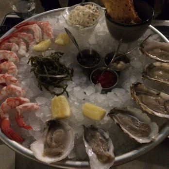 Marsh House - Seafood tower- crab on top with bread, left is shrimp, oysters along right - Southern Near Me - Nashville, Tennessee