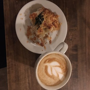 Lantern Coffee Bar and Lounge - (1/2 eaten) Spinach croissant and latte - Coffee & Tea Near Me - Grand Rapids, Michigan