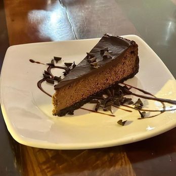 TRiO Restaurant & Market - Dark chocolate and goat cheese cheesecake. Order it! Goat cheese in a cheesecake? Yes, please! - Wine Bars Near Me - Kitty Hawk, North Carolina TRiO Restaurant & Market - Dark chocolate and goat cheese cheesecake. Order it! Goat cheese in a cheesecake? Yes, please! - Wine Bars Near Me - Kitty Hawk, North Carolina