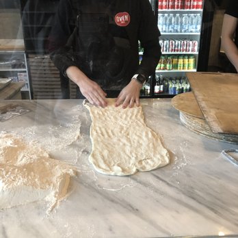 Oven 360 Walkerside - a person making a pizza - Pizza Near Me - Windsor, Ontario Oven 360 Walkerside - a person making a pizza - Pizza Near Me - Windsor, Ontario
