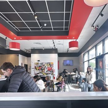 Bonchon Petaluma - N McDowell Blvd - [INTERIOR] Fast food style seating. Largest table seats 6 or 8. Line runs along the wall & order at counter. - Asian Fusion Near Me - Petaluma, California