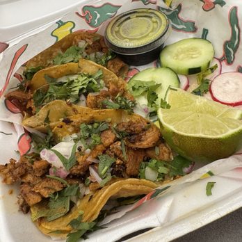Villa's Patio Mexican Restaurant - Al pastor tacos with green salsa, radishes, cucumbers, and lime slices. - Mexican Near Me - Marion, Iowa