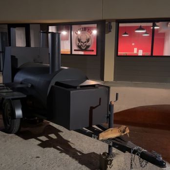 Outlaw BBQ - a grill on a trailer in a parking lot - Coffee & Tea Near Me - Moville, Iowa