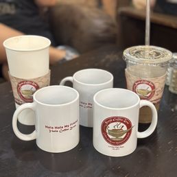 four coffee cups on a table