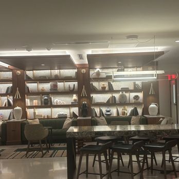 Annex - A wall of decorative books & sitting areas - Wine Bars Near Me - Fort Worth, Texas