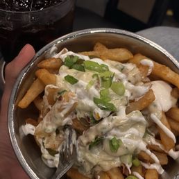 Cheese fries with fries, queso, jalepenos, chives, bacon, and sour cream (optional)