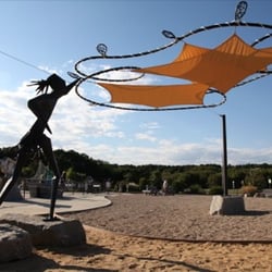 Pilgrim Bark Park - This shade installation celebrates a way of life of the Cape Cod Native American Indian. Artist: Chris Williams.