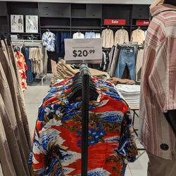 H&M - These racks are too close and the mannequin, considering the table behind the shirts.