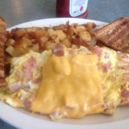 Special today. Ham and cheese with home fries toast and coffee. Very filling. Special today. Ham and cheese with home fries toast and coffee. Very filling.