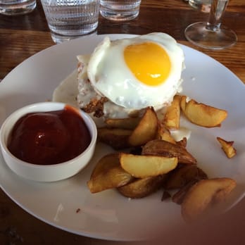 The Table - Fried chicken with biscuit and gravy topped with sunny side up egg and a side of potato wedges - New American Near Me - San Jose, California