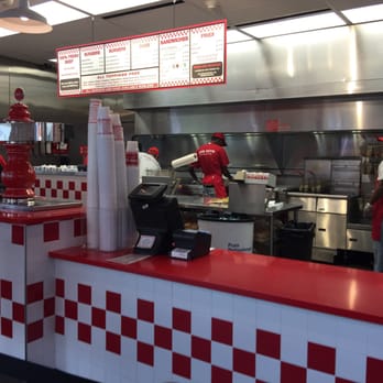 Five Guys - a restaurant kitchen with red and white checkered counter tops - Burgers Near Me - Columbus, Ohio