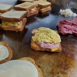 Ham Egg and Cheese in the back and Reuben being cooked