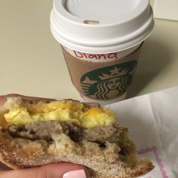 Starbucks - Sausage and egg sandwich paired with an extra hot caramel macchiato. - Coffee & Tea Near Me - Miami, Florida Starbucks - Sausage and egg sandwich paired with an extra hot caramel macchiato. - Coffee & Tea Near Me - Miami, Florida