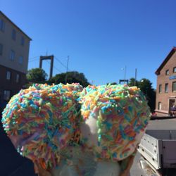 Triumf Glass - Strawberry, vanilla, and pear with rainbow sprinkles in a cone