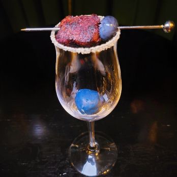 Georgia Boy - a glass of cocktail with a garnish on the rim - New American Near Me - Atlanta, Georgia Georgia Boy - a glass of cocktail with a garnish on the rim - New American Near Me - Atlanta, Georgia
