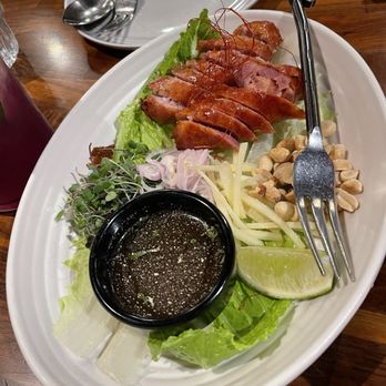 Hanuman Thai Eatery - Thai sausages served with Jeaw sauce - Thai Near Me - Costa Mesa, California Hanuman Thai Eatery - Thai sausages served with Jeaw sauce - Thai Near Me - Costa Mesa, California