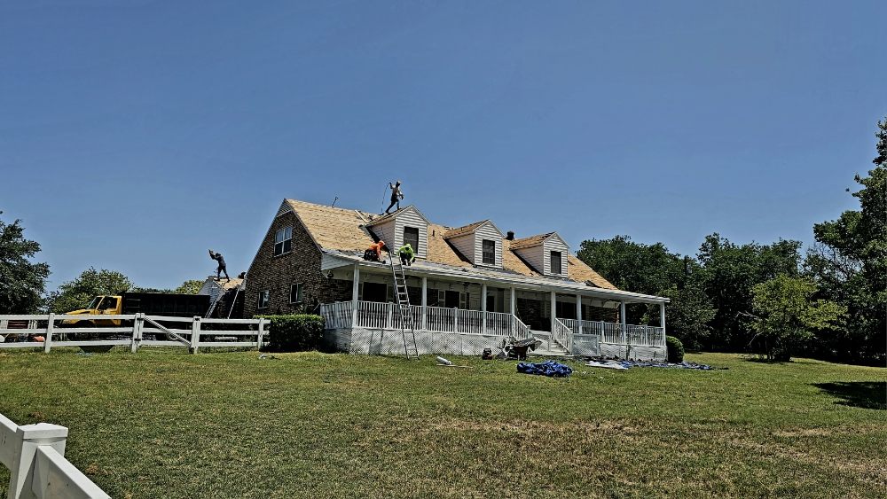 Slide of RE Roofing and Construction