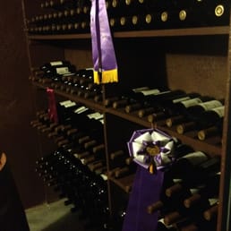 a wine rack with wine bottles