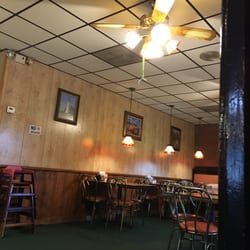 Pizza Inn - Snazzy green yarn hanging from the ceiling fan that may or may not have been bought at a garage sale.