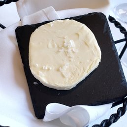 Butter on a square slate. Interesting way to serve butter. Butter on a square slate. Interesting way to serve butter.