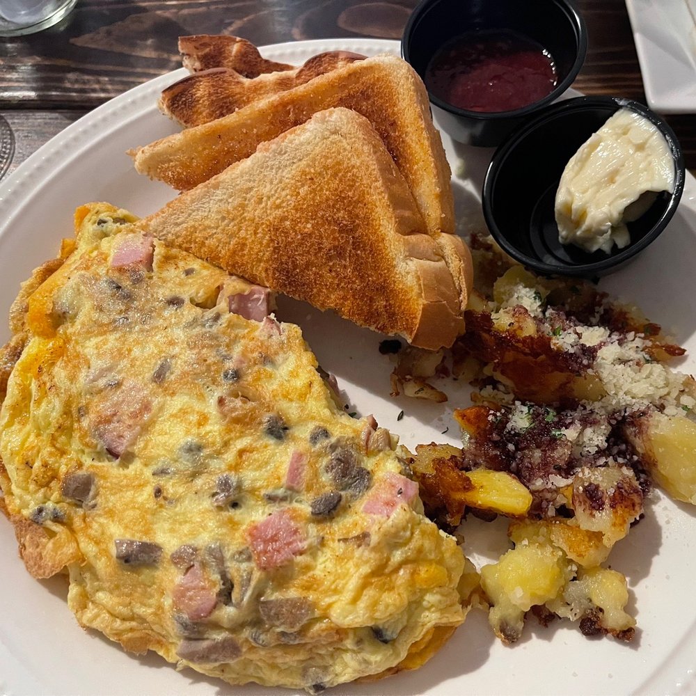 Author's Kitchen + Bar - Omelette with cheddar cheese, caramelized onions, mushrooms and ham, plus white toast. - Bars Near Me - Appleton, Wisconsin