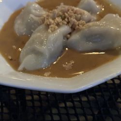 Madame Thai - Chicken dumplings, steamed and served warm with peanut sauce