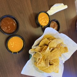 Chente Cafe - Chips with cheese and salsa courtesy snacks.