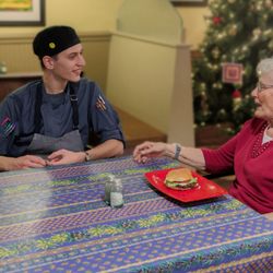 Garden Spot Village - Cook spending time with residents.