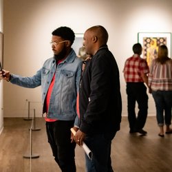 MW Gallery - Visitors admiring artworks on view during "African Art Now," June 2019.