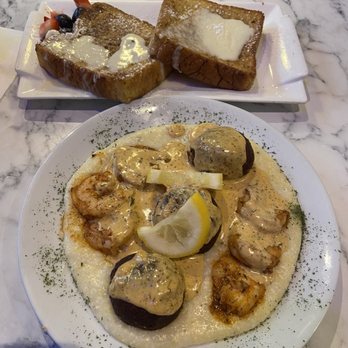 Frost Bistro & Bar - Salmon balls with grilled shrimp and grits with a creole cream sauce. Also a side of frosty French toast.... And it was BUSSIN‼‼ - Breakfast & Brunch Near Me - Atlanta, Georgia Frost Bistro & Bar - Salmon balls with grilled shrimp and grits with a creole cream sauce. Also a side of frosty French toast.... And it was BUSSIN‼‼ - Breakfast & Brunch Near Me - Atlanta, Georgia