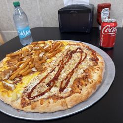 Alessio’s Pizza and Grill - Boardwalk pizza (fries, chicken, bacon, mozzarella, cheddar) and BBQ chicken pizza with pineapple.