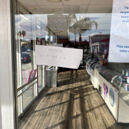 Tacky sign indicating a random closure for 30-minute break with no return time.