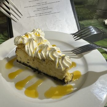 Kaleo's Bar and Grill - Lilikoi cheesecake with Oreo crust. There were only two pieces left by the time we ordered! - Hawaiian Near Me - Keaau, Hawaii Kaleo's Bar and Grill - Lilikoi cheesecake with Oreo crust. There were only two pieces left by the time we ordered! - Hawaiian Near Me - Keaau, Hawaii