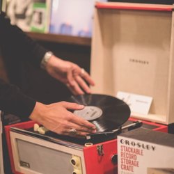 Rock Cellar Records - Turntables, cleaning kits, and storage crates are also available for purchase.